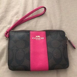 Dark brown and pink coach wristlet